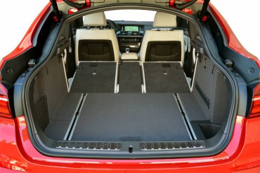 The BMW X4 cargo area is big and flat with a slick cargo hold down system.