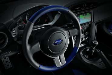The excellent contoured steering wheel would be even better with auxiliary radio controls.